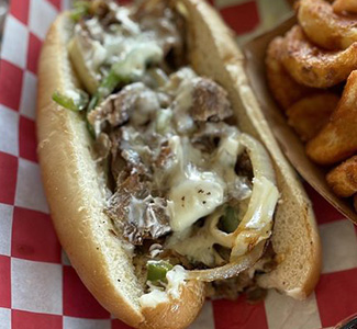 Cheesesteak made famous by Woodbooger Bar and Grill in Norton, Virginia. Available on the food truck menu!